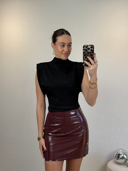 Glitter top met schoudervulling - zwart