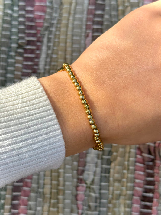 Elastiek kralen armband - goud